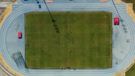 overhead still shot of a soccer game in the football field, drone tripod mode in portugal