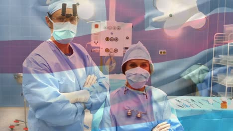 Animation-of-flag-of-england-waving-over-surgeons-in-operating-theatre