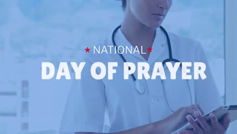 Animation-of-national-day-of-prayer-text-over-caucasian-female-doctor-using-tablet
