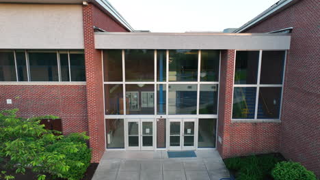 aerial pullback of brick elementary school in america