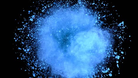 super slow motion of colored powder explosion isolated on dark background.