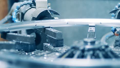 close up shot of a machine making holes in a bicycle rim