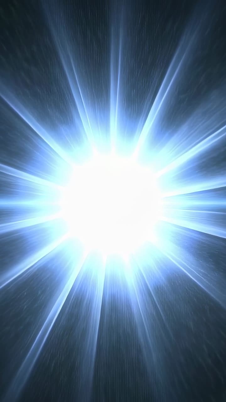Vertical video: Surging core fueling point light growth in dark, sending starburst rays and specks