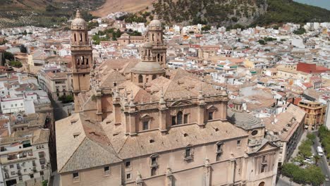 Spain-Jaen-Cathedral,-Catedral-de-Jaen,-flying-shoots-of-this-old-church-with-a-drone-at-4k-24fps-using-a-ND-filter-also-it-can-be-seen-the-old-town-of-Jaen