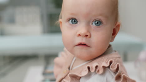 Cute-Baby-Girl-Playing-with-Stethoscope-and-Looking-at-Camera