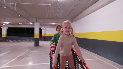 siblings having fun on shopping center parking lot