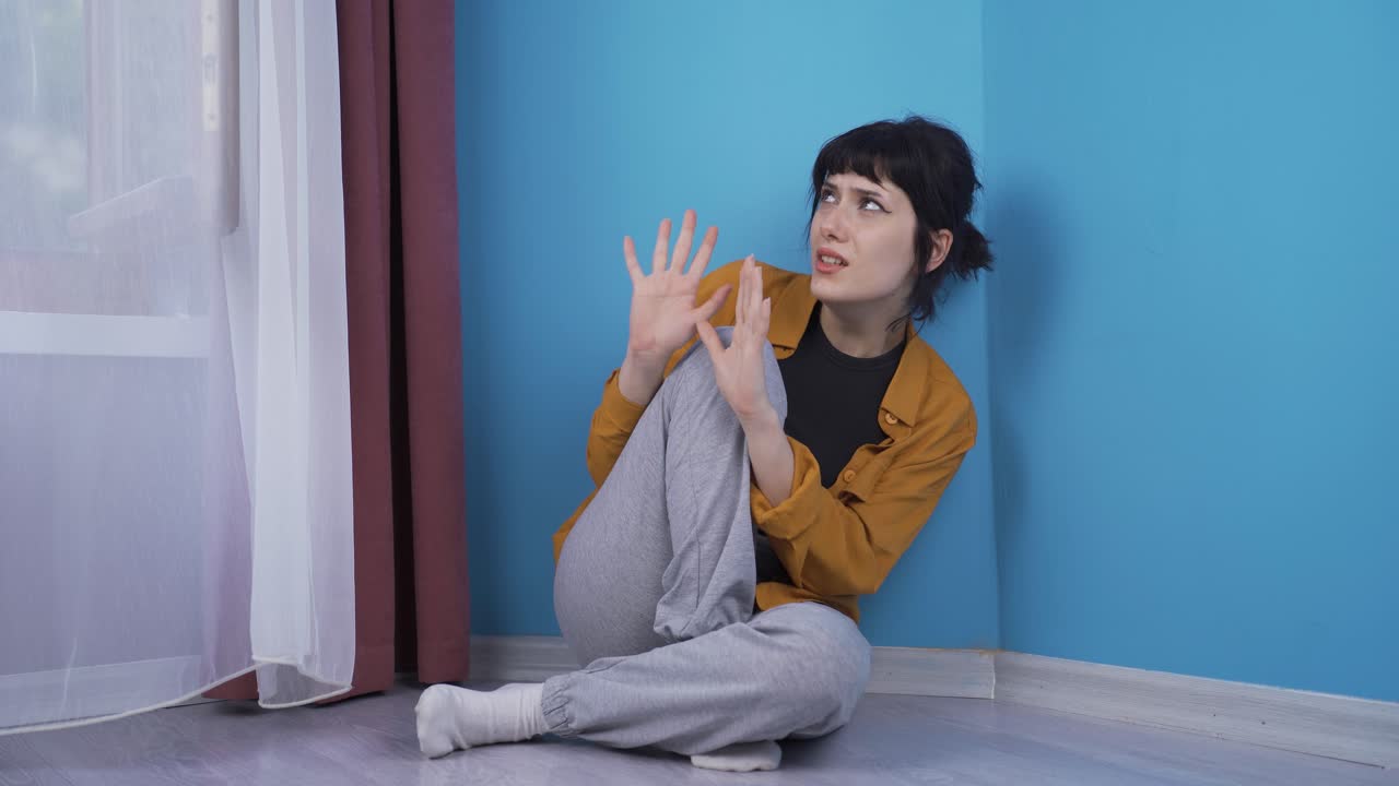 Paranoid guy pretending someone's coming.