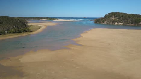 aerial sideways view of corindi river mouth, new south wales