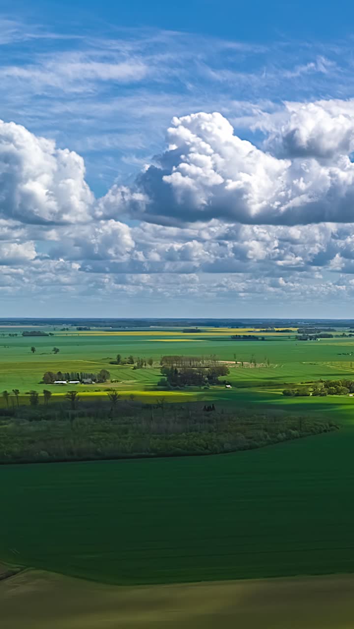 Farmland agriculture land countryside aerial drone timelapse hyperlapse moving clouds skyline