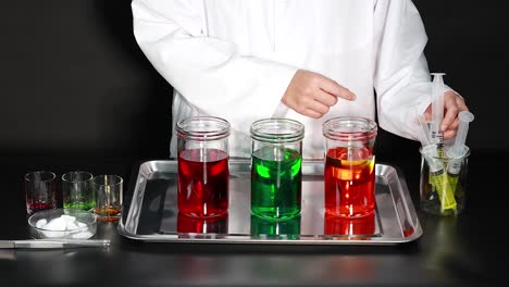 scientist conducts colorful liquid and foam experiment