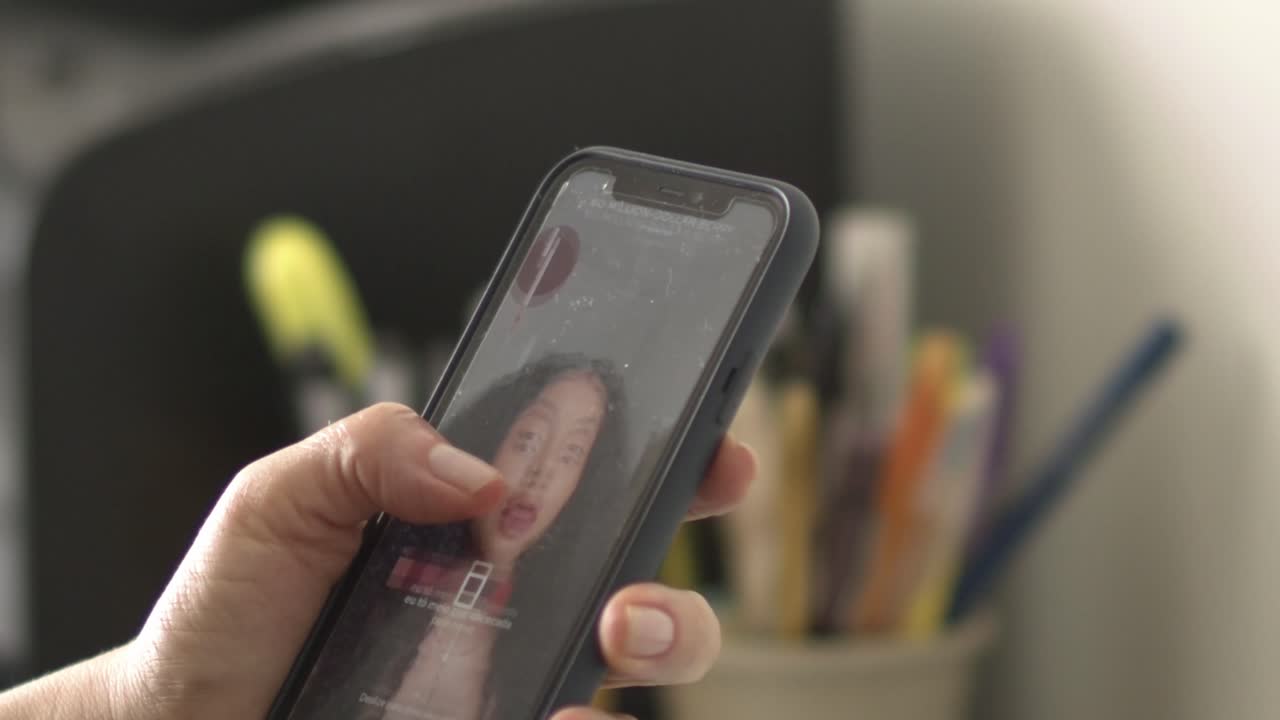Woman using TikTok on her smartphone