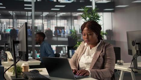 woman working on laptop in office