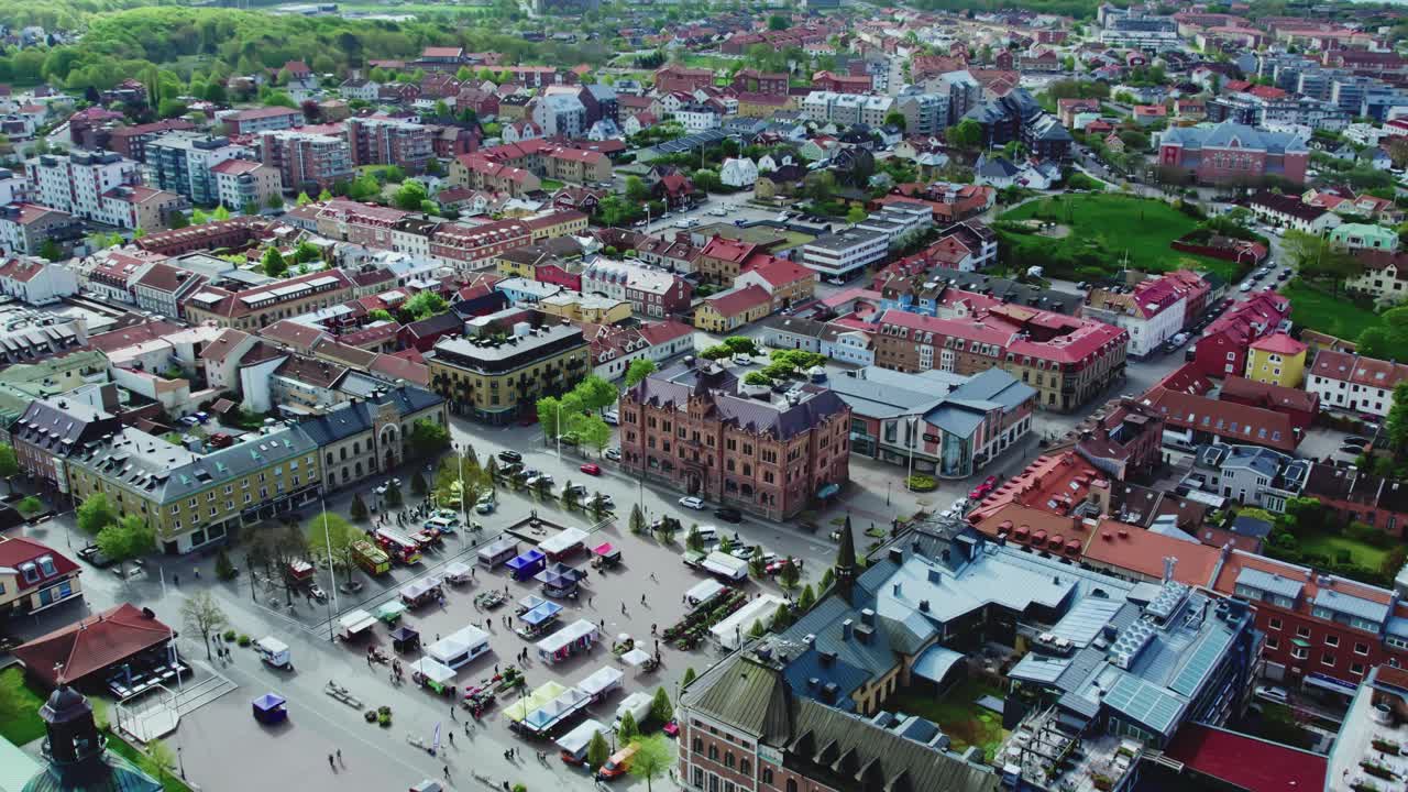 Small Street Market at Varberg Square in Varberg city. Drone view