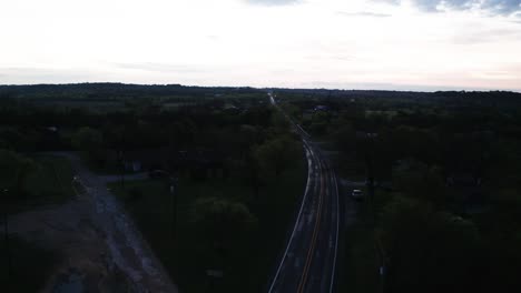 aerial view of a road through a town at dusk