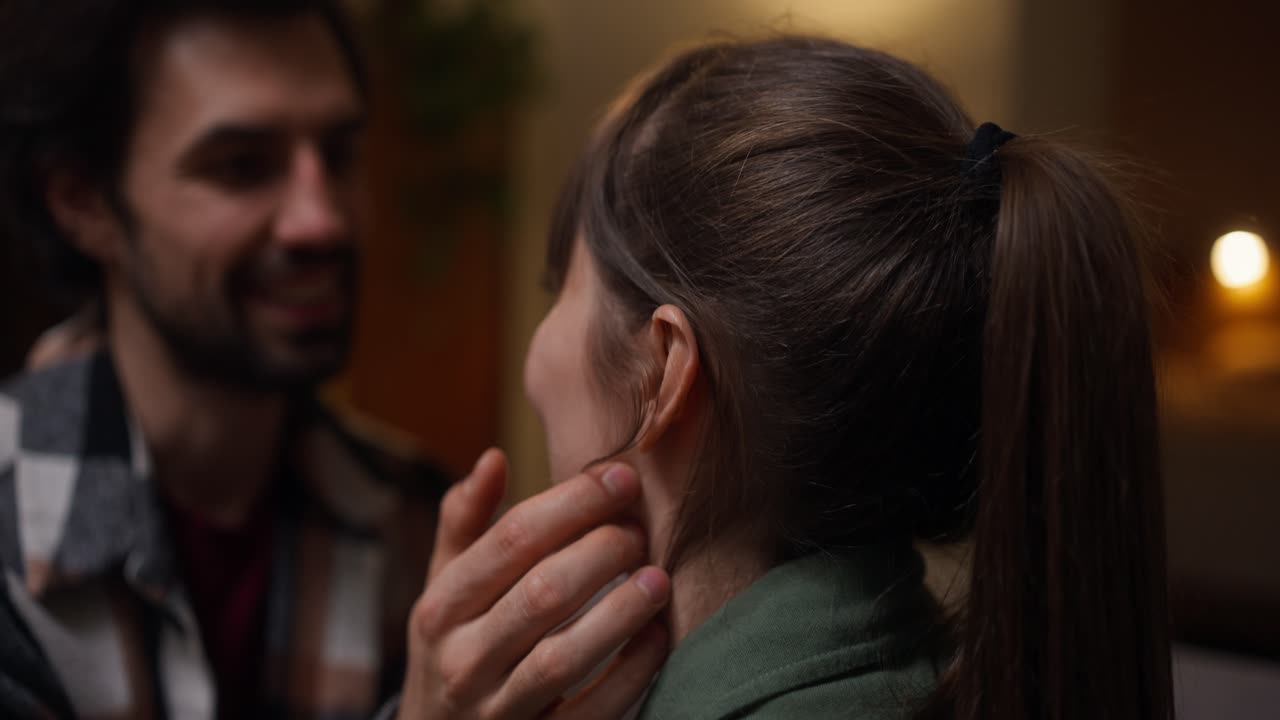 A couple sharing an intimate moment of affection and tenderness