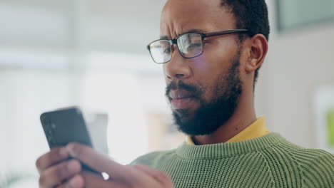 Phone,-message-and-confused-man-in-a-living-room