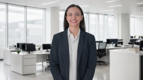 Happy-Indian-business-woman-smiling-to-the-camera