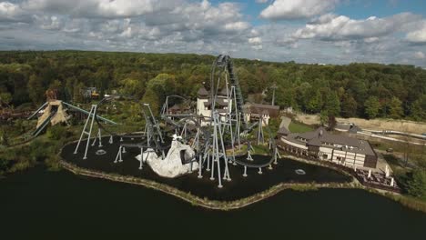 roller coaster in a joyful amusement park located in a city park in poland during the summer