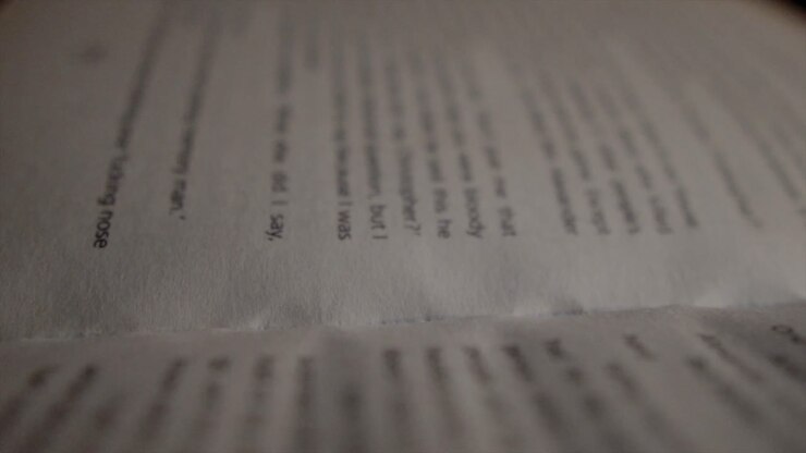 Close up of an open book page with out of focus words