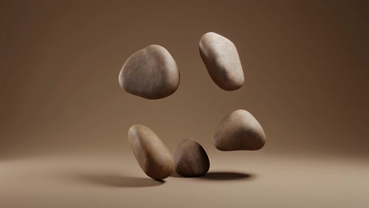 Four Smooth Stones Floating in a Minimalist Studio Setting