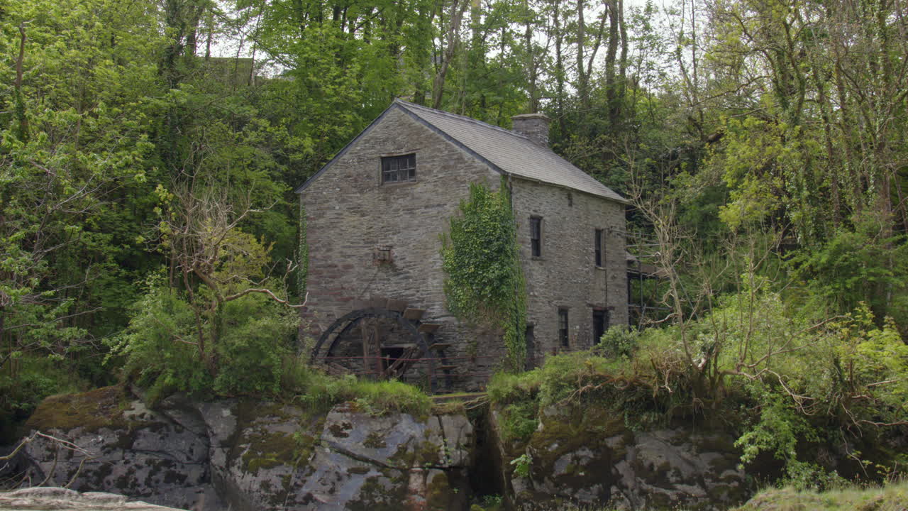 shot of the 17th century flour mill at Cenarth Falls on the river Teifi
