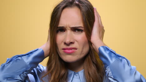 business woman holding hands on head. tired woman having headache after work