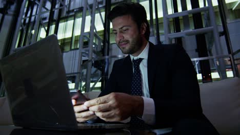 arabic businessman night office technology laptop smart phone