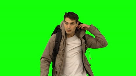 Handsome-man-walking-towards-the-camera-on-green-screen