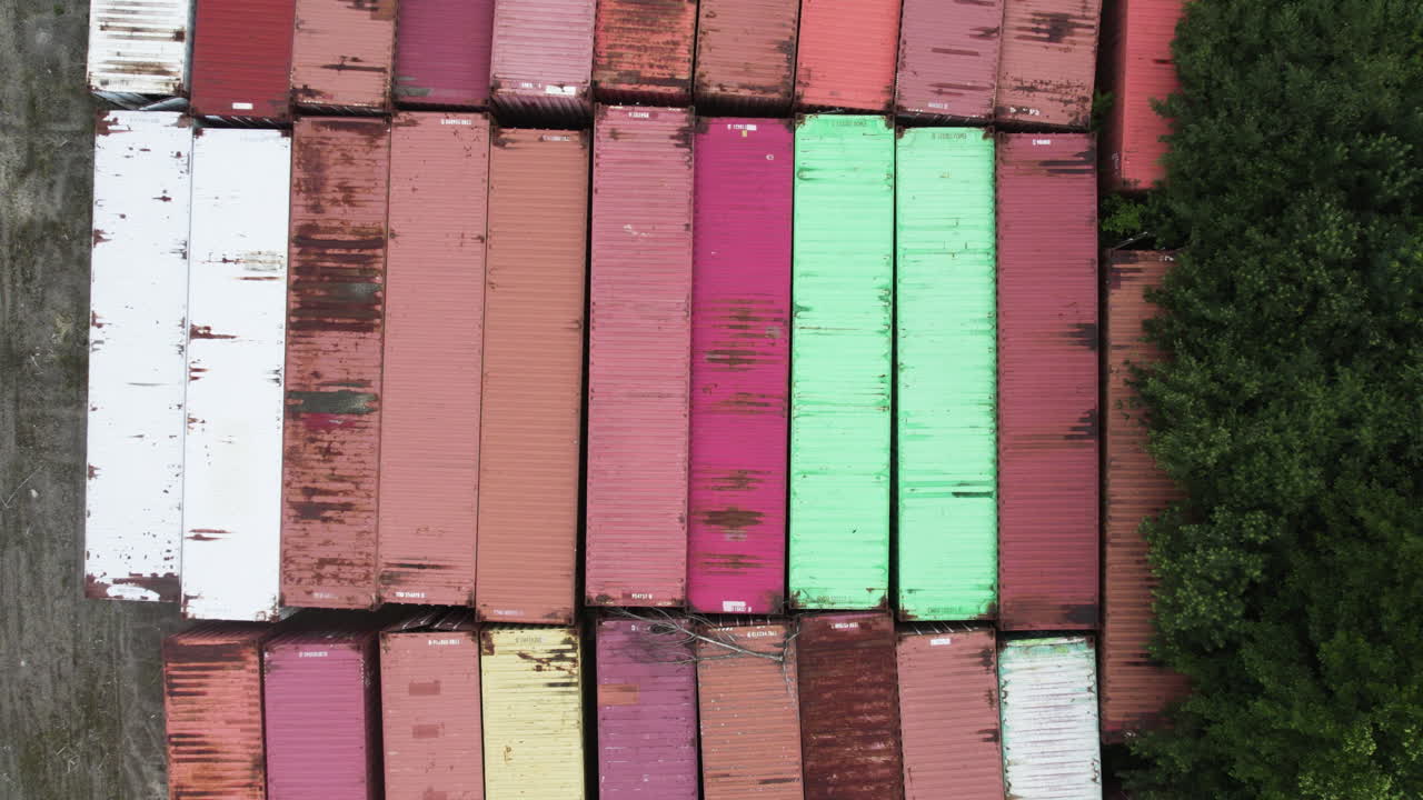Aerial shot of colorful shipping containers stacked neatly in Sweden