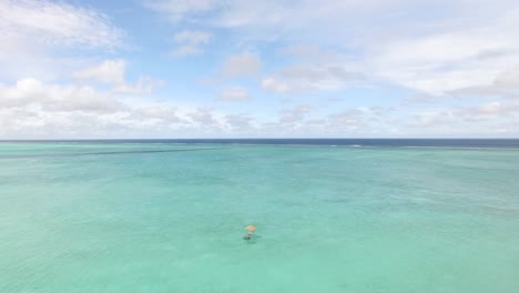 A-Tourist-Lounges-In-A-Hammock-In-The-Waters-Of-Maldives