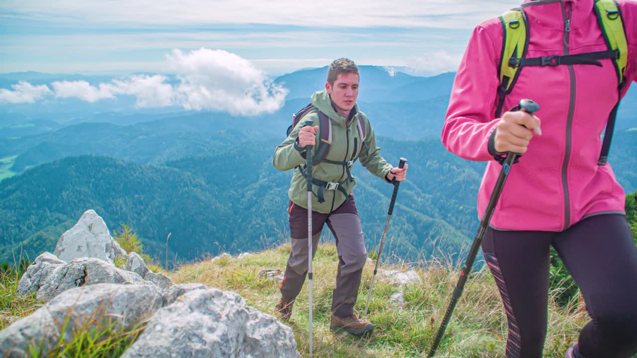 young active couple hike together on Urslja mountain track