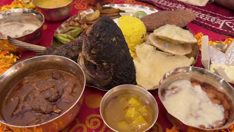 closeup shot of bengali traditional food with fish, rice and sweet platter