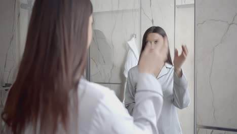 woman getting ready in bathroom