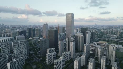 cityscape of shanghai china around construction site aerial drone fly metropolis skyscrapers of asia, skyline background