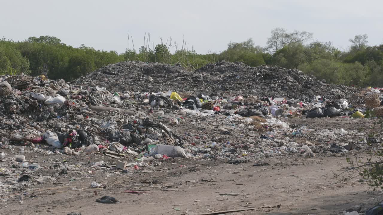 Rubbish tip, landfill, waste area in Lembongan Bali ground shot alternate