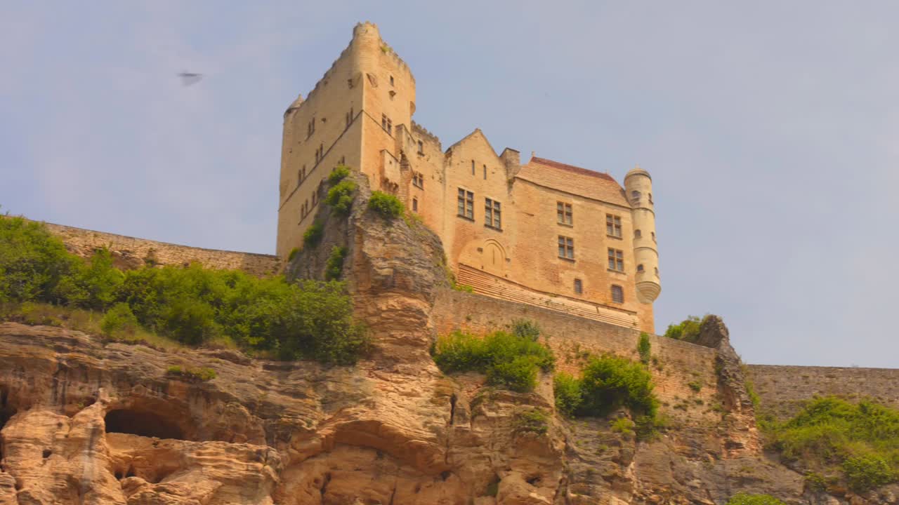 A view of a medieval castle on a rocky cliff
