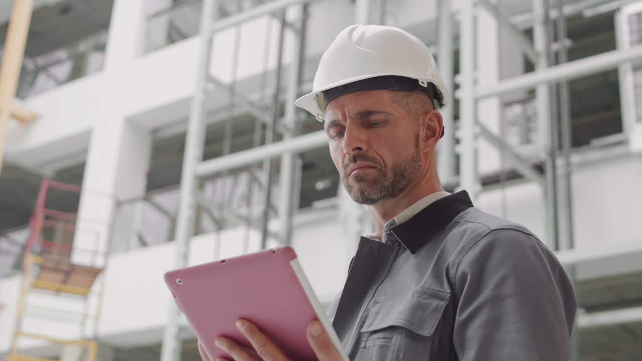 Caucasian Builder Using Tablet Computer