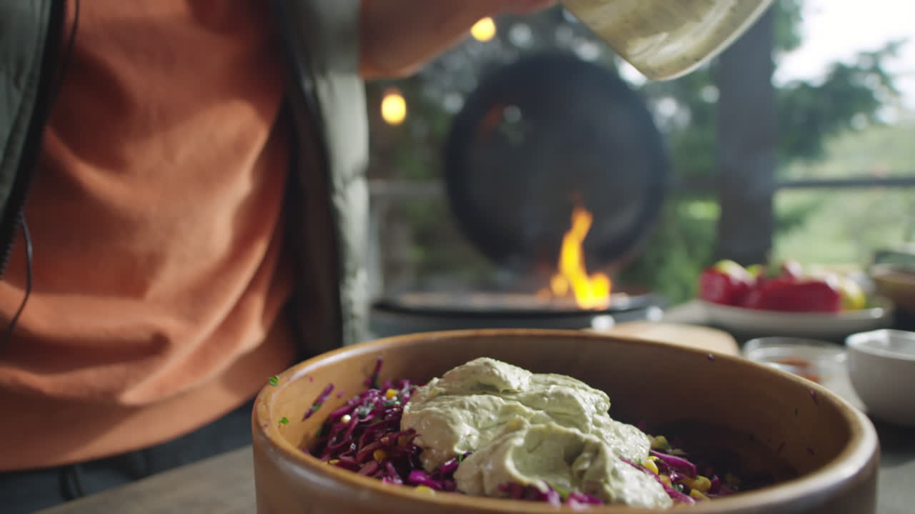 Mixing Salad with Creamy Dressing