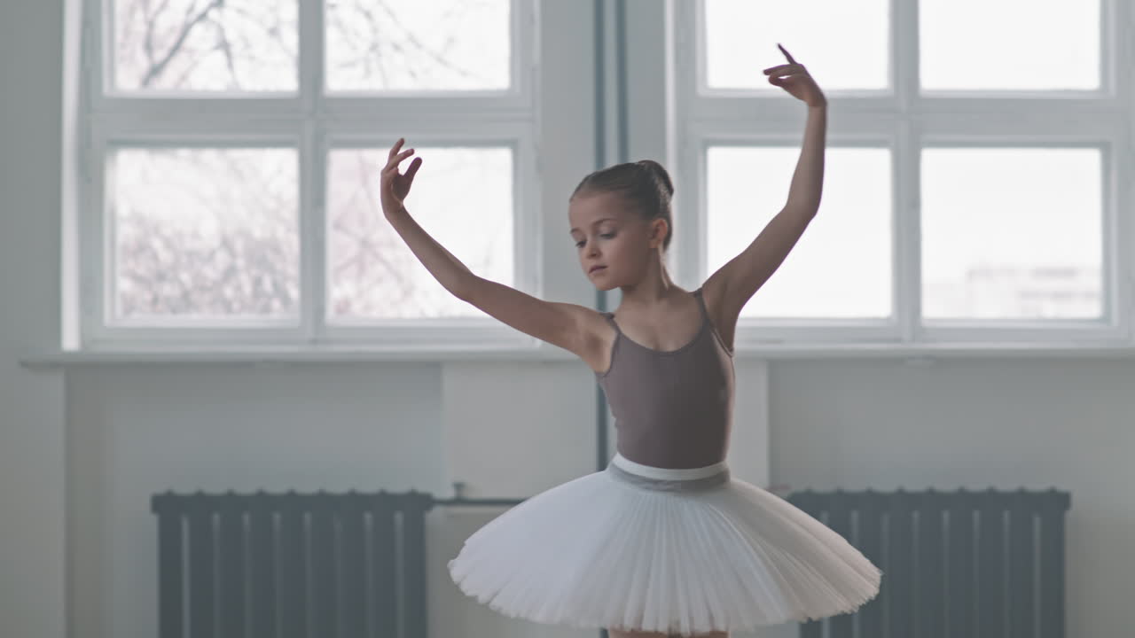 Talented Little Ballerina Dancing In Studio