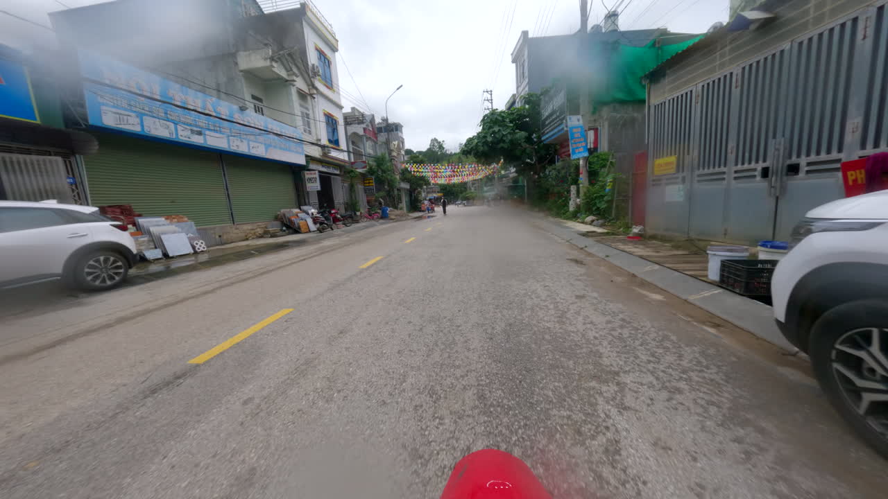 Motorcycle Driving On The City Road Of Ha Giang Province In Northern Vietnam. POV Shot