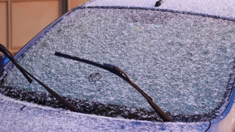 snow-covered car windshield