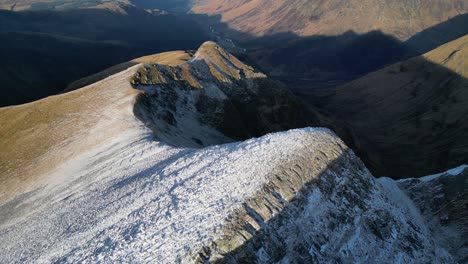 snowy mountain ridge aerial stob ban highlands scotland in winter