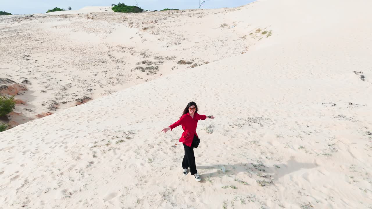 Aerial View of a Girl Dancing in the Desert in Vietnam.