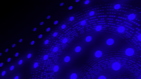 animación de círculos brillantes azules giratorios sobre un fondo negro.