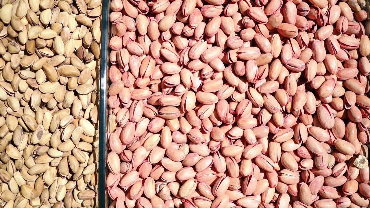 Top View of Shelled and Unshelled Pistachios in Containers