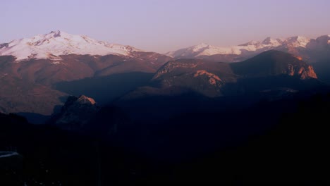 sunrise timelapse over pyrenees mountains, soft pink glow, winter serenity and renewal