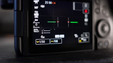 Close-Up-Shot-Of-Back-Of-Digital-LCD-Camera-Screen-Showing-Informational-Icons