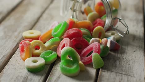 video of colourful jelly candy and on wooden background