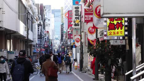 pedestrians navigating a busy urban shopping district