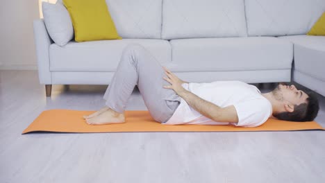 man working abs on floor.